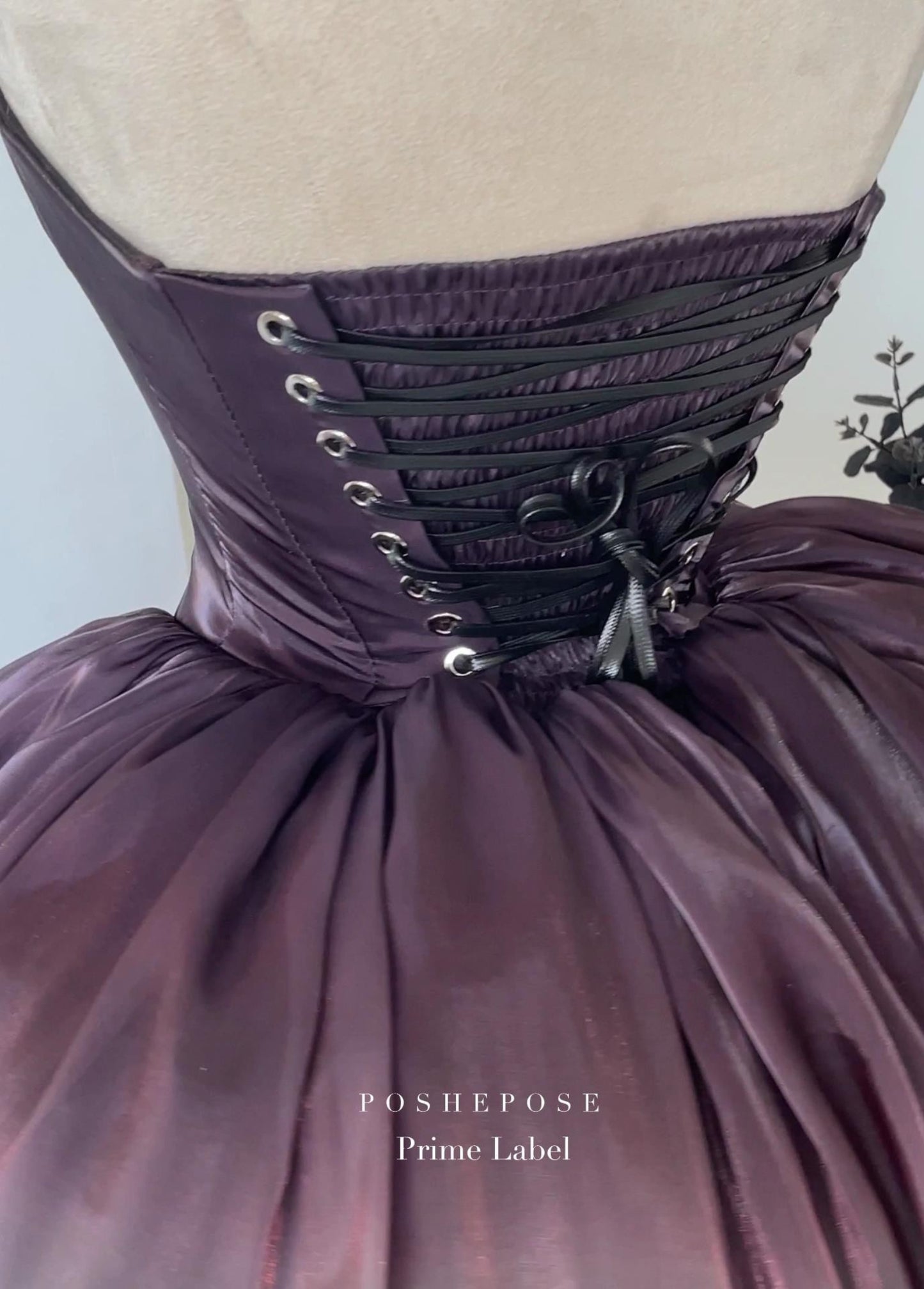 Elegant fantasy dress with flowing gradient skirt and black accents.