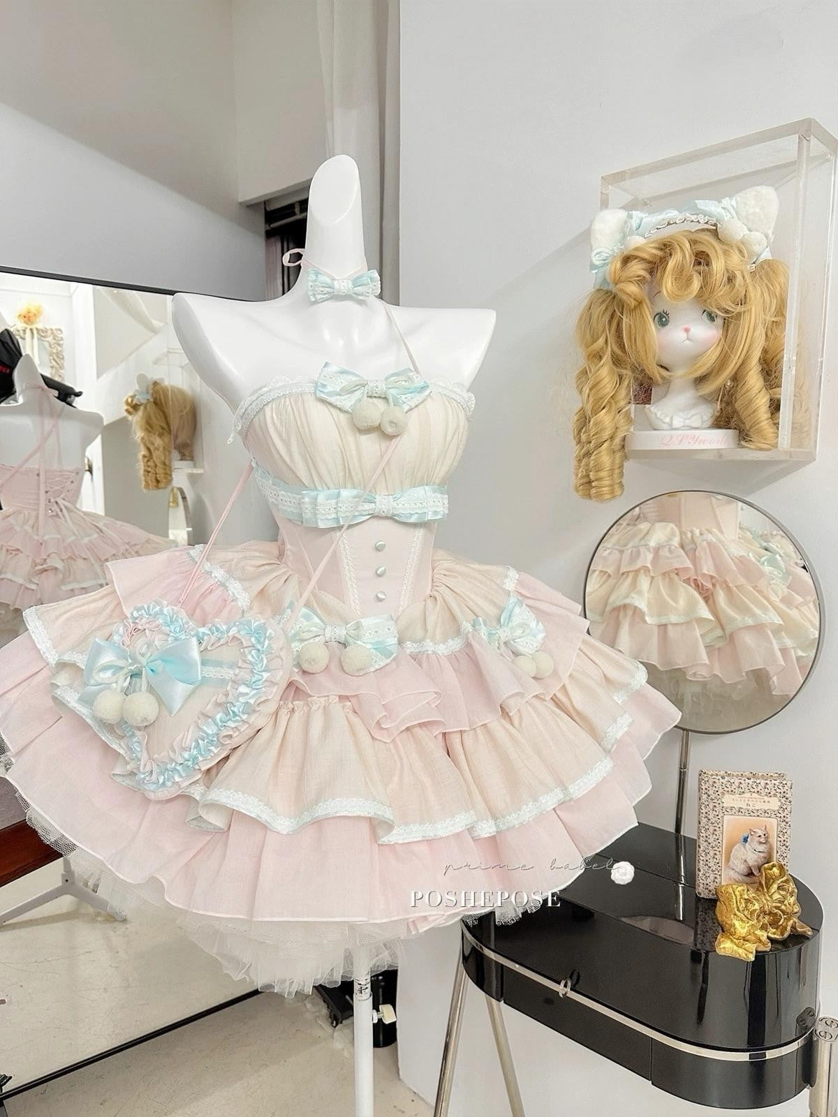 Frilly mint and blush pink lolita outfit with lace details and pearl accents by Poshepose Global.
