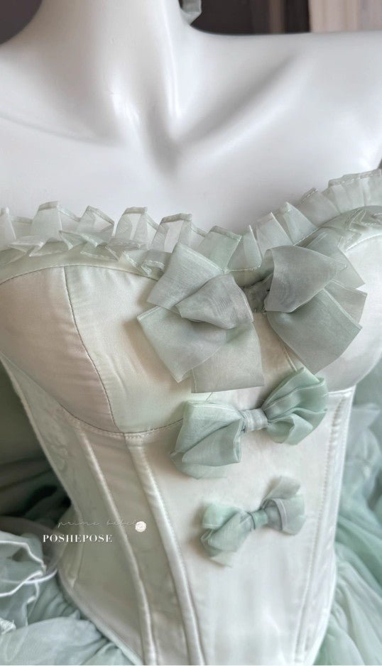 Close-Up of Mint Green Satin Corset Bodice with Organza Bows and Pleated Trim - PoshePose Global