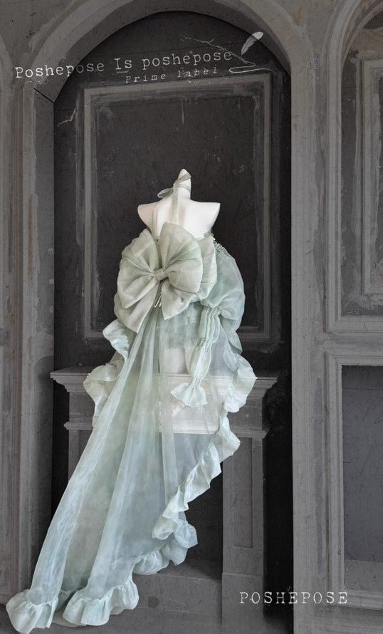 Back View of Mint Green Haute Couture Gown with Oversized Statement Bow and Flowing Ruffled Train - PoshePose Global