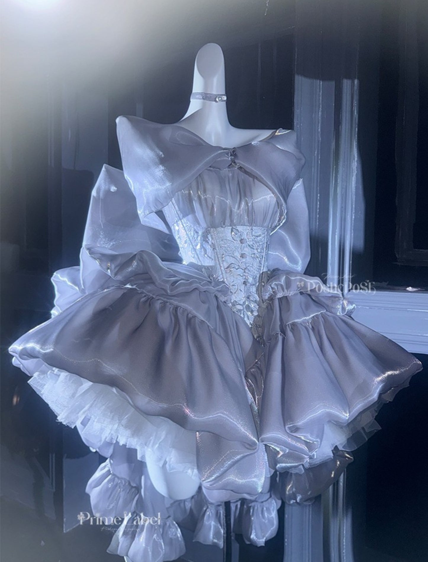 Balletcore silver dress featuring voluminous layers and soft gloss
