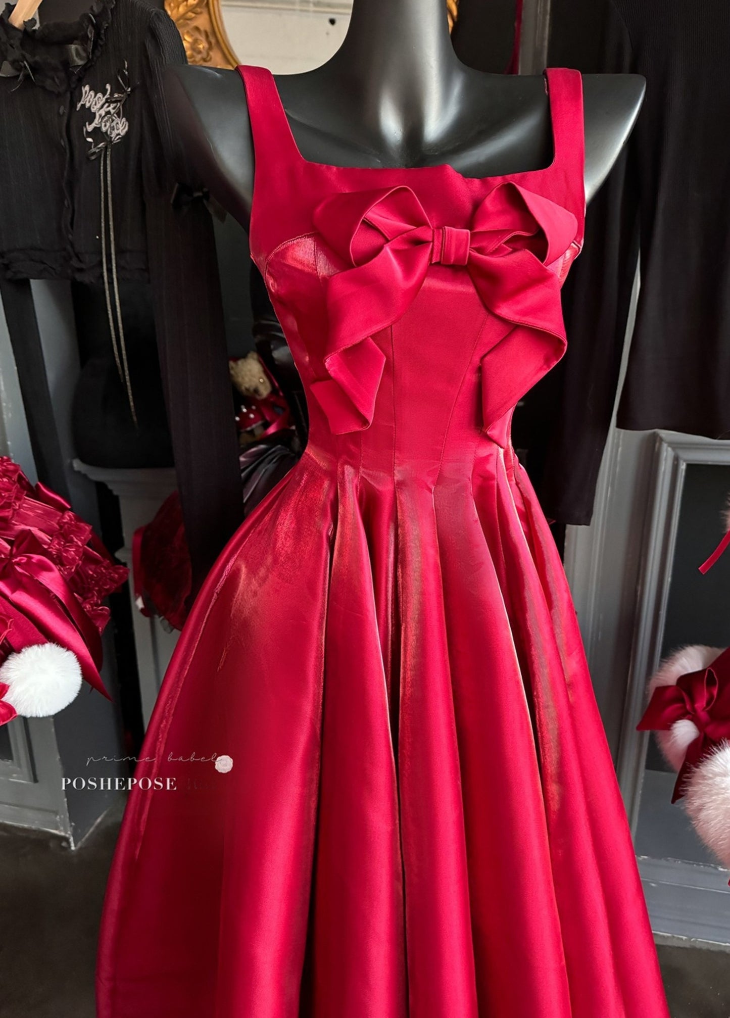 Glamorous holiday dress with statement bow details.