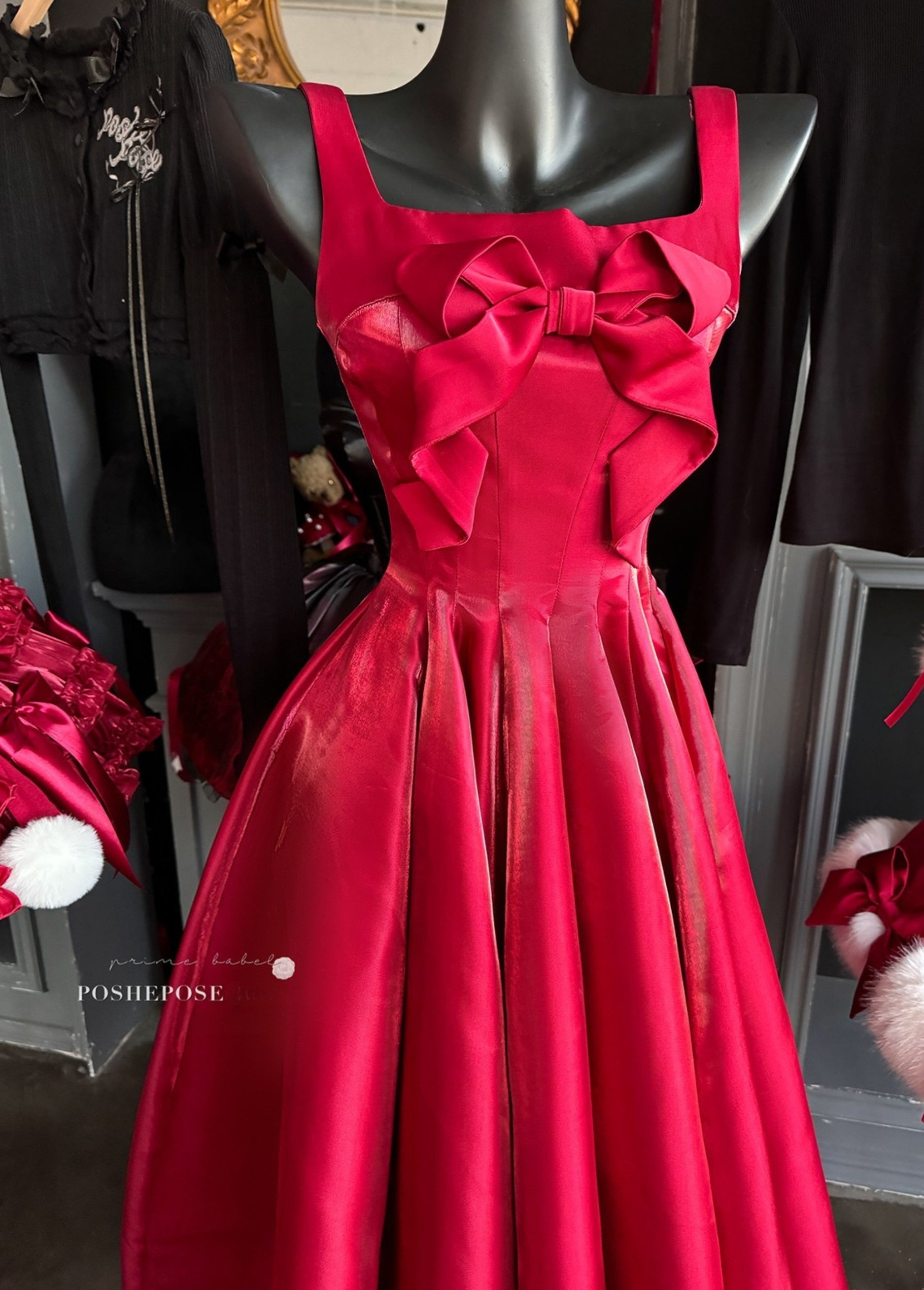 Glamorous holiday dress with statement bow details.