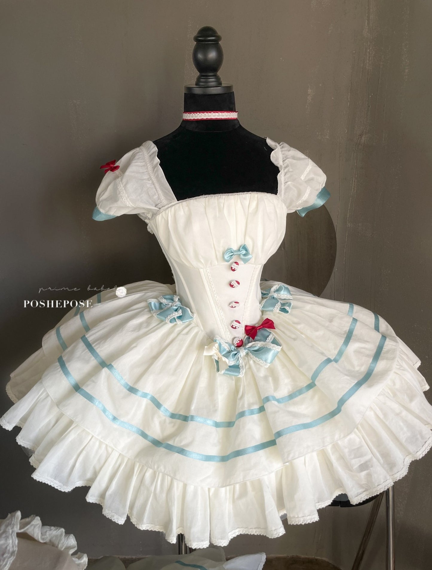 Sweet Lolita corset dress with puffed sleeves and lace hem.