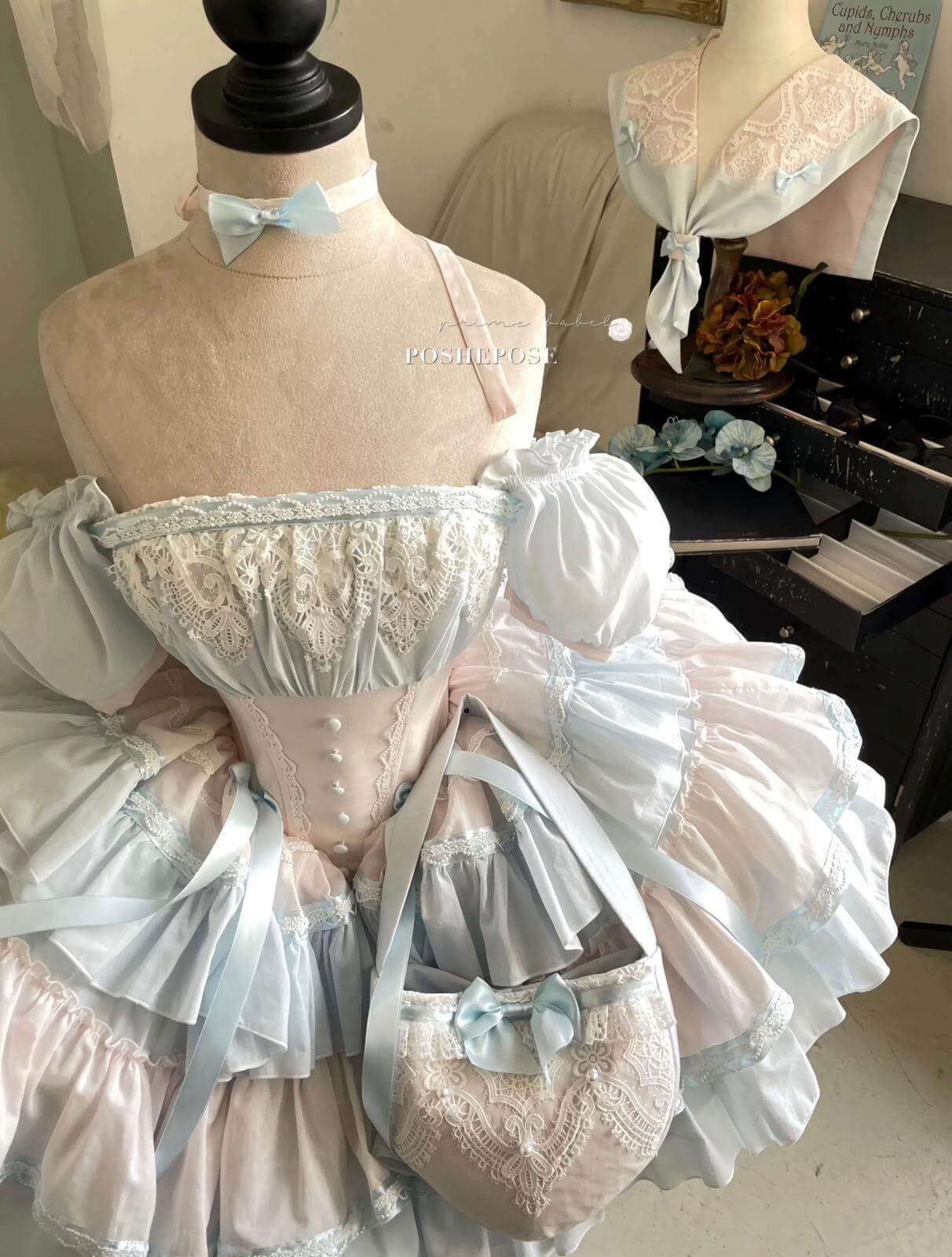 Gardenia Promise dress in vintage pastel shades with lace-trimmed layers.