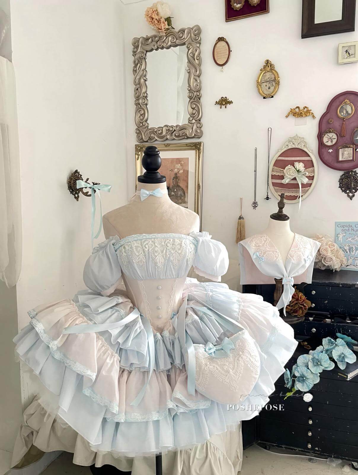 Luxury lolita vintage dress featuring corset waist, bows, and tiered skirt.