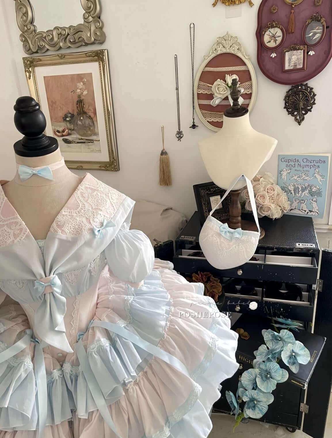 Delicate pink and blue vintage dress with lace collar and satin ribbons.