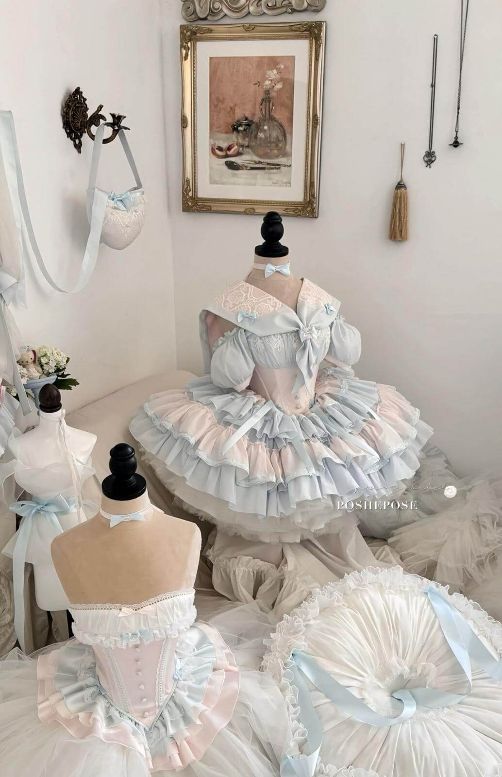Fairycore-inspired lolita dress in soft pink and blue hues with lace detailing.