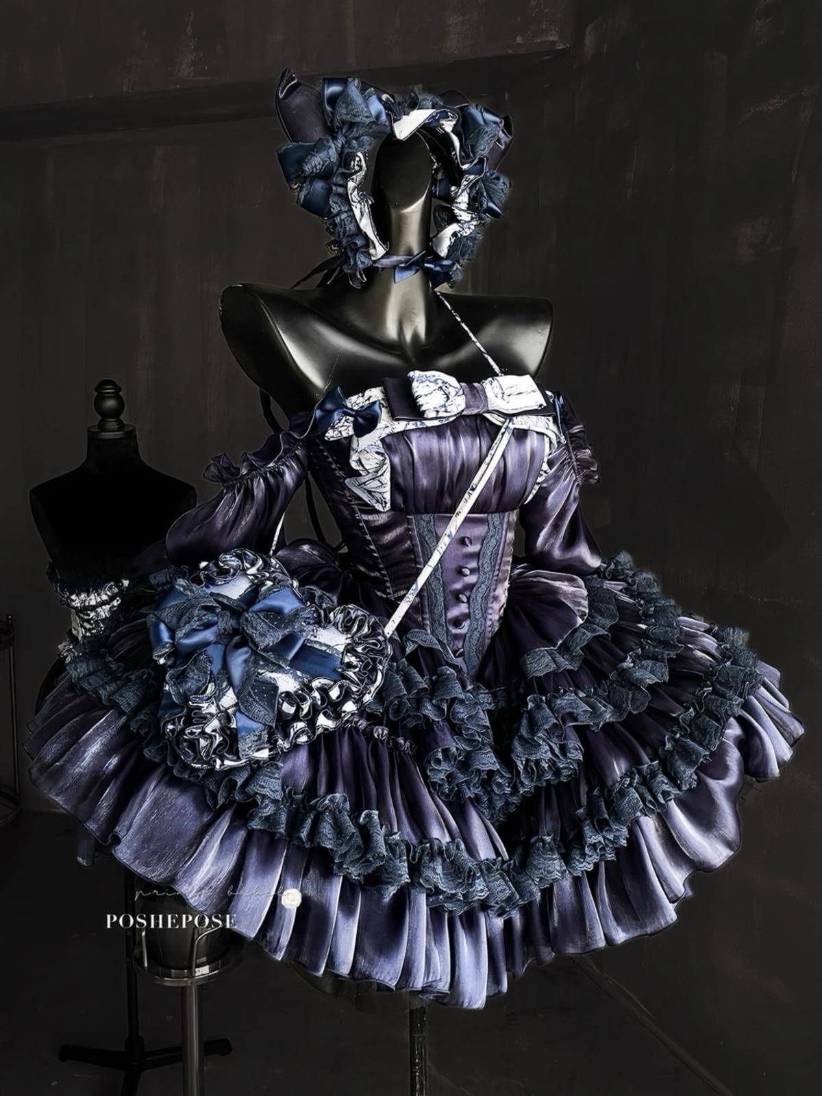 Luxury Rococo-inspired navy lolita dress with puff sleeves and layered ruffles.