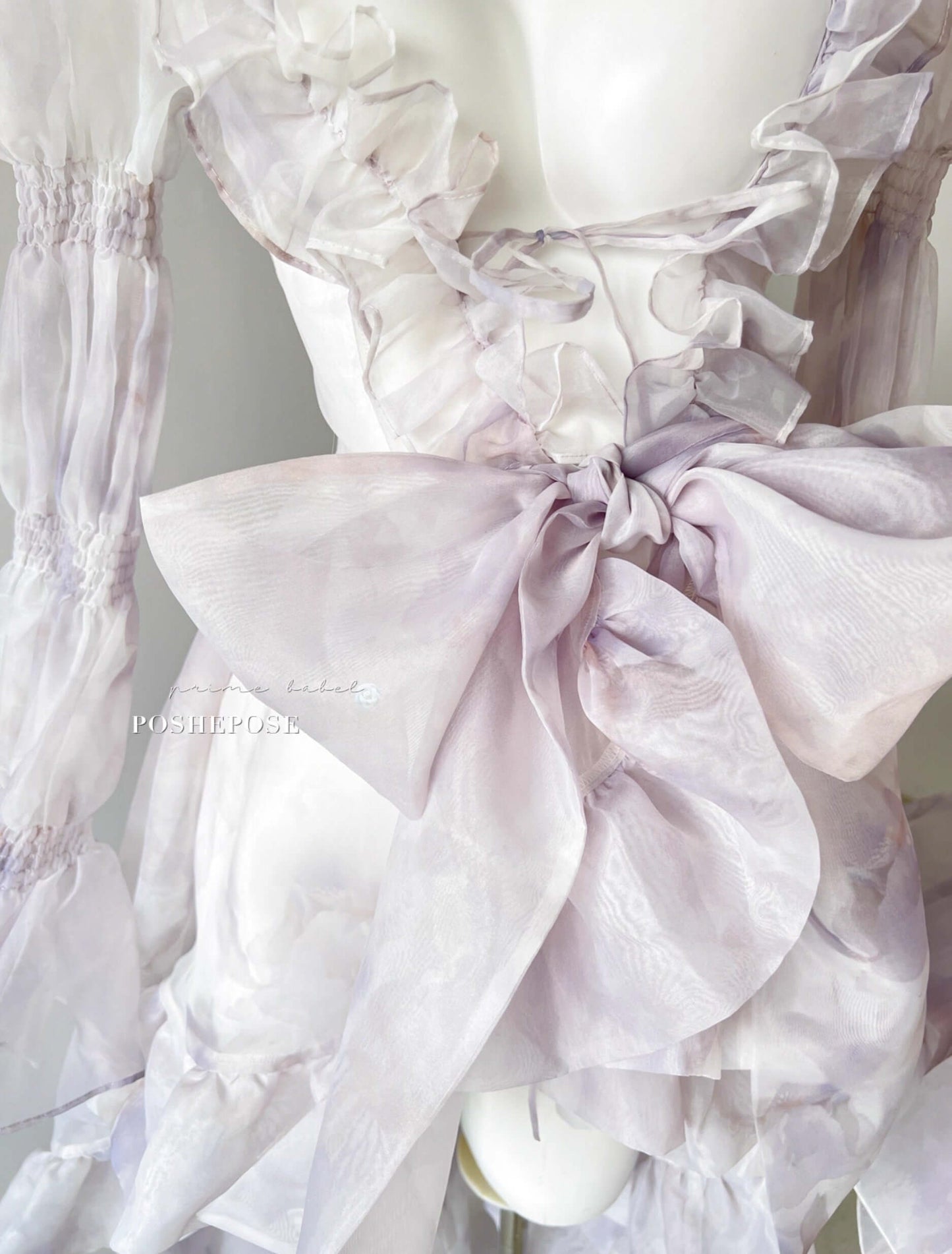Ethereal layered dress with cascading organza cape in Iris purple by Poshepose Global.