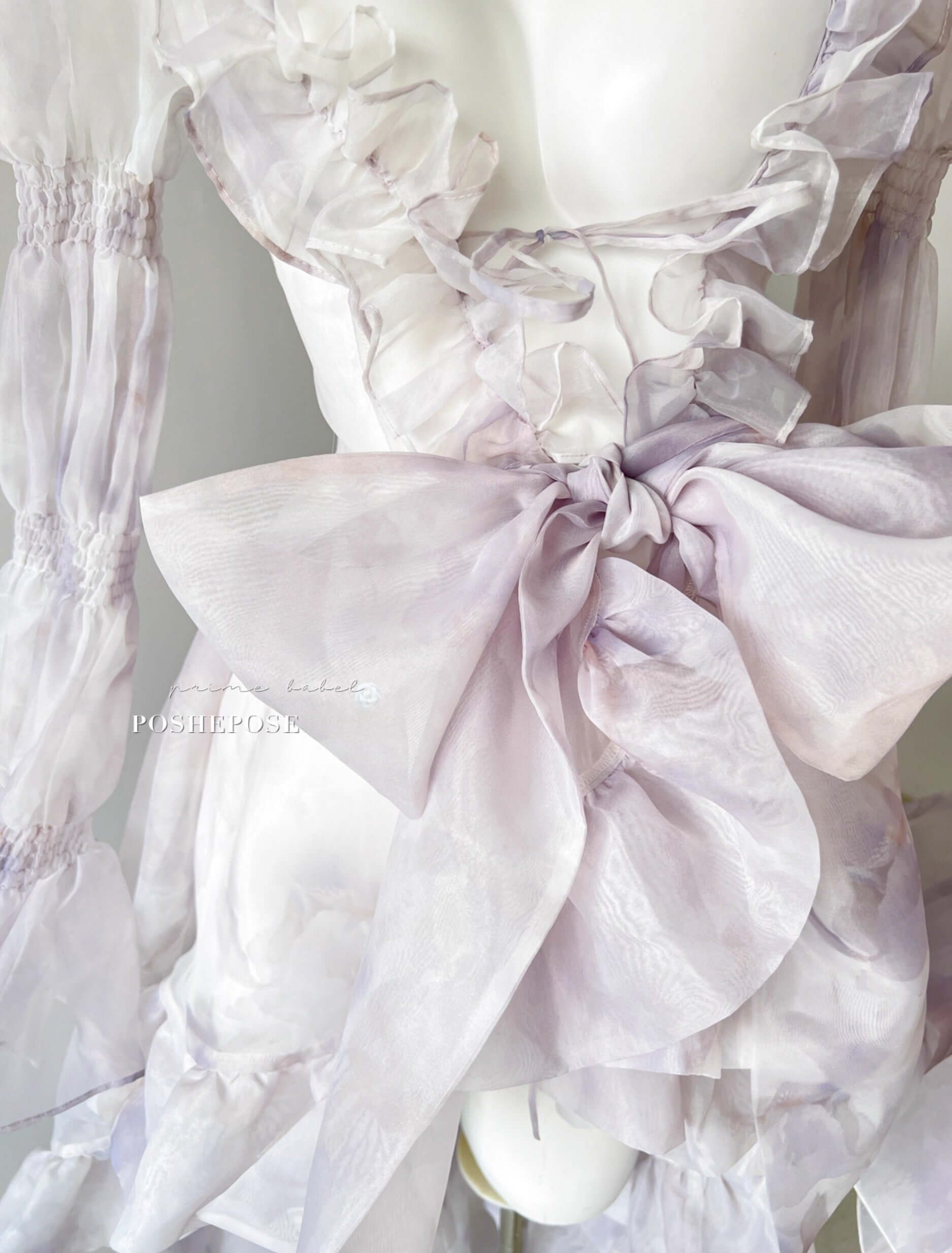 Ethereal layered dress with cascading organza cape in Iris purple by Poshepose Global.