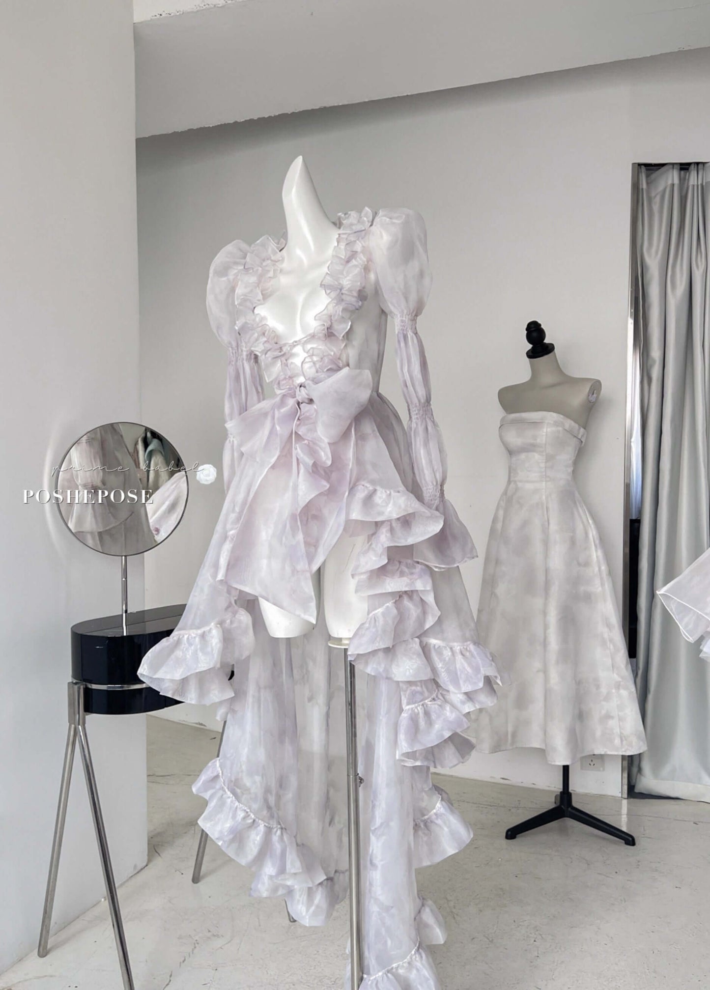 Lavender couture dress set featuring structured corset and sheer layered cape by Poshepose