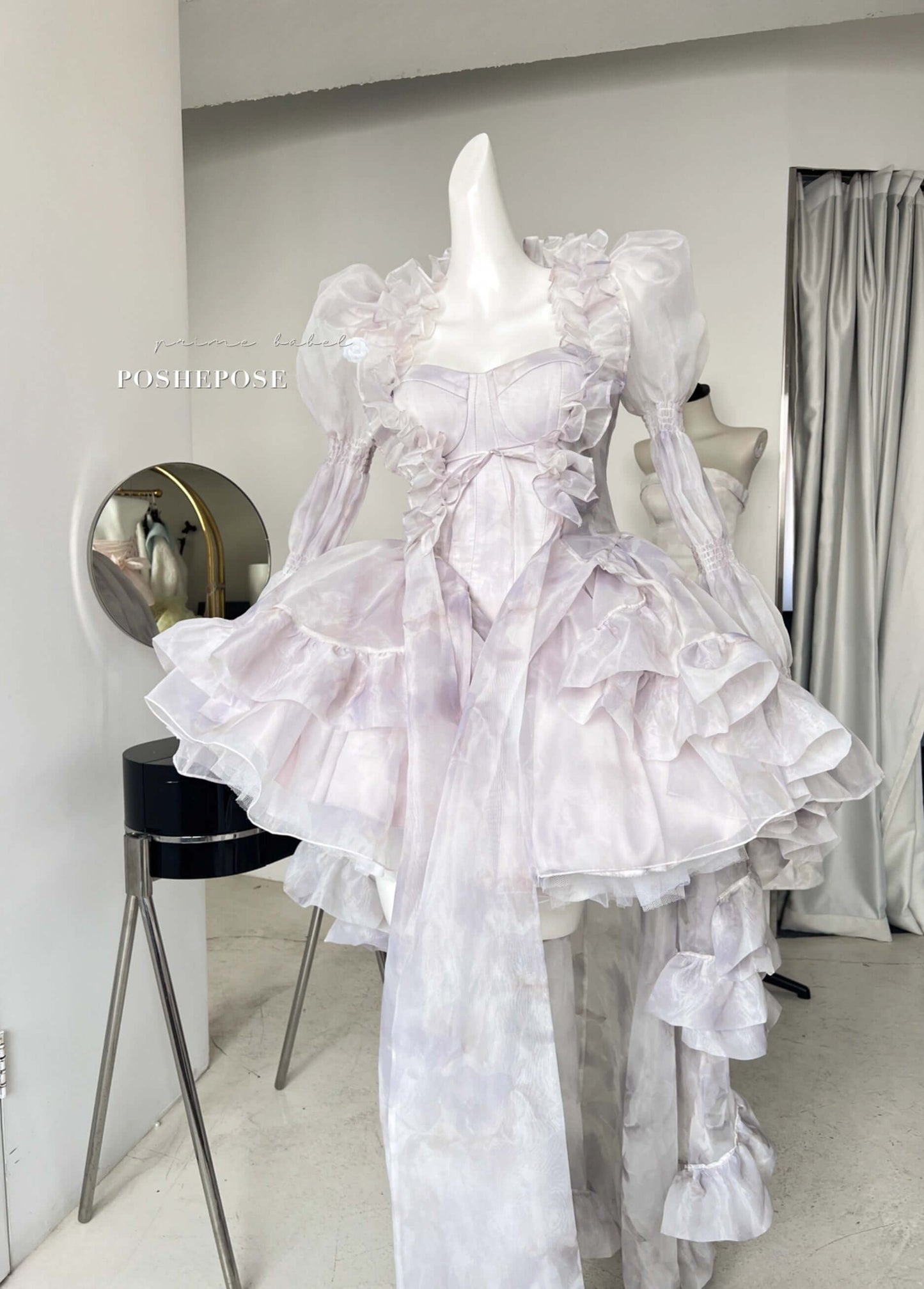 Dreamy Rococo-inspired organza cape with long train and delicate ruffle edges.
