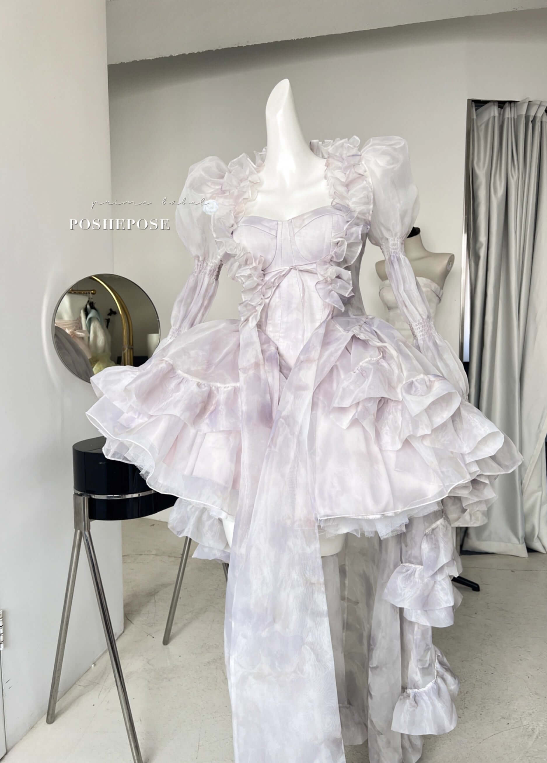 Dreamy Rococo-inspired organza cape with long train and delicate ruffle edges.