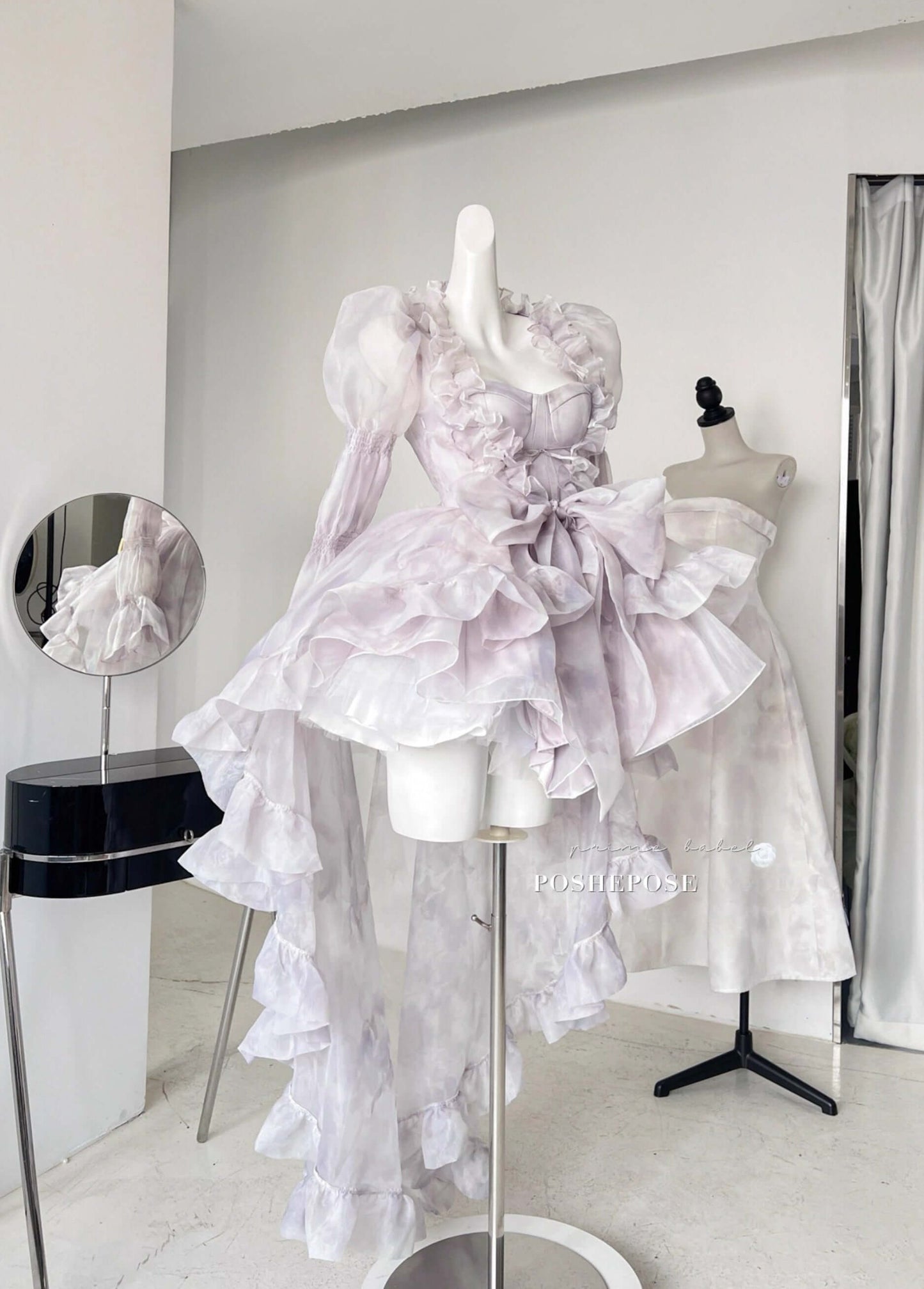 Luxury fairycore cape dress with lavender hues and transparent puffed sleeves.