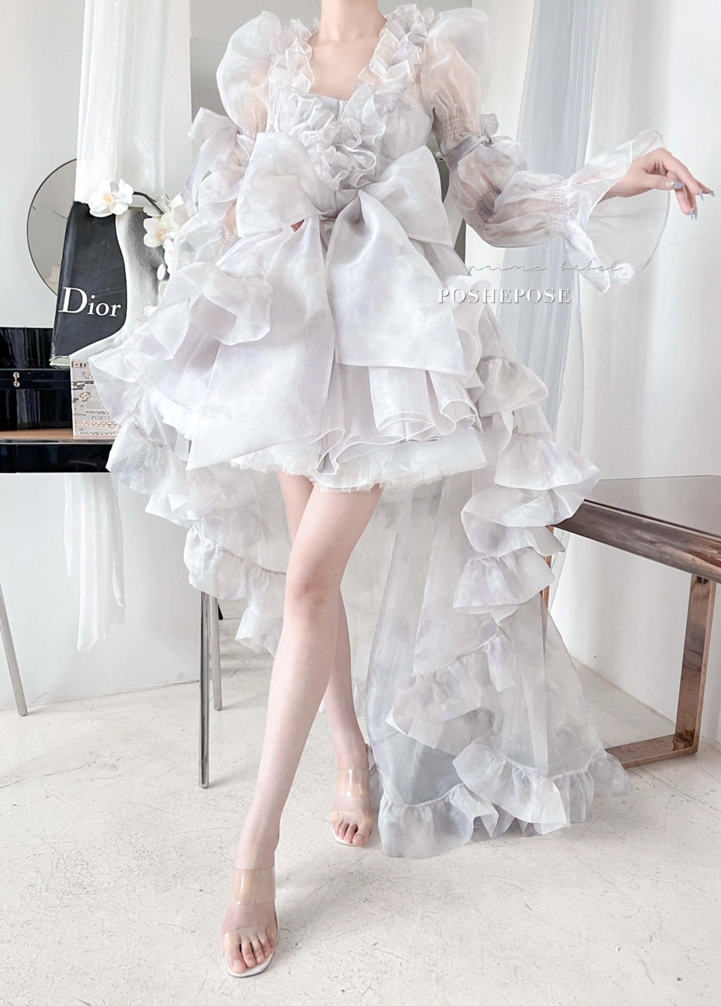 Lavender Rococo lolita gown with romantic ruffles and oversized pastel bow.