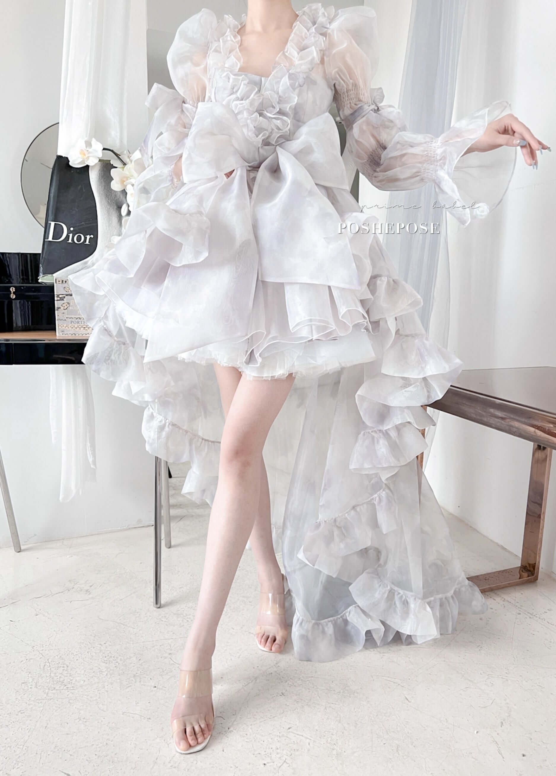 Lavender Rococo lolita gown with romantic ruffles and oversized pastel bow.