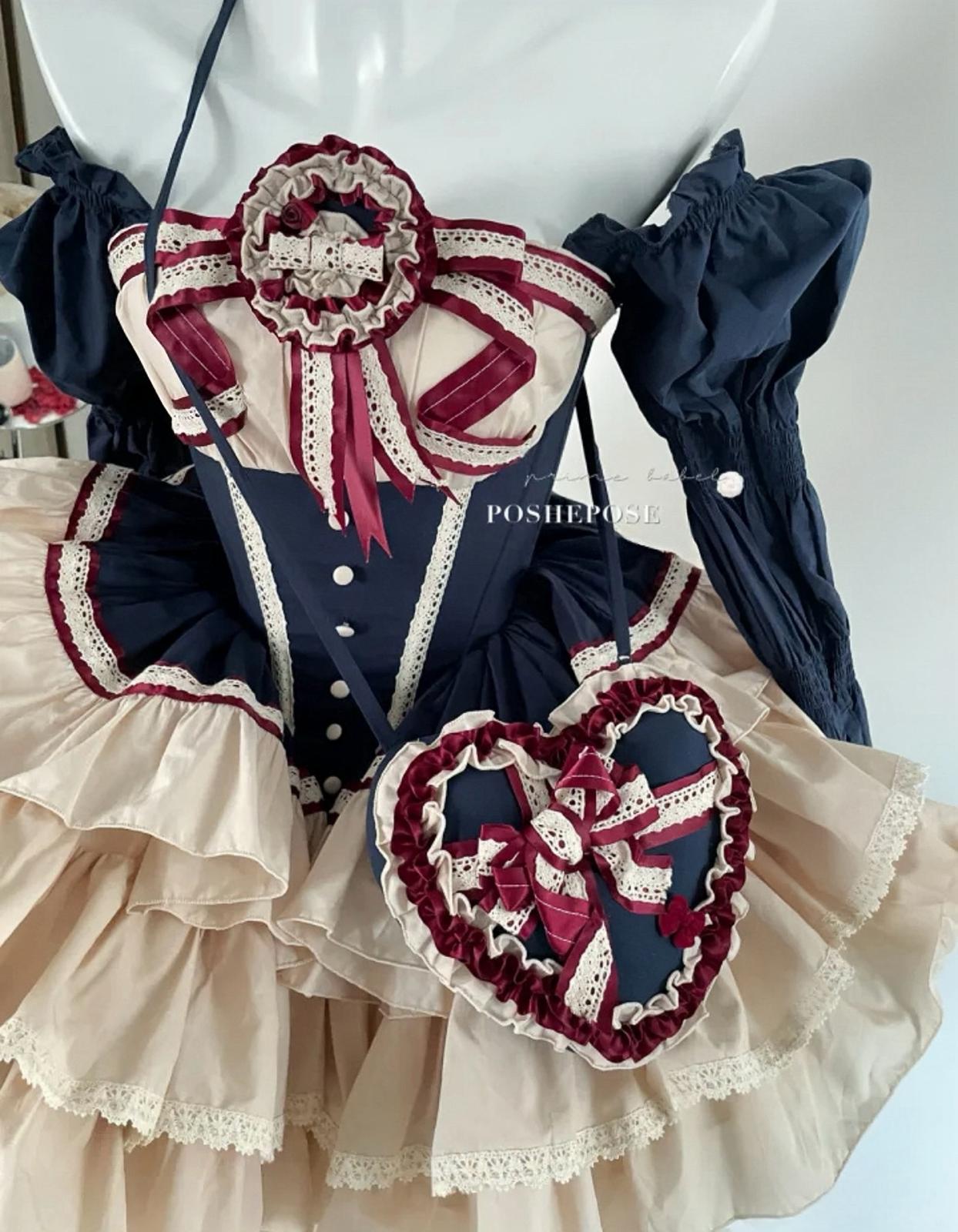 Cream and navy lolita corset dress with vintage ribbon trim and heart-shaped bag.