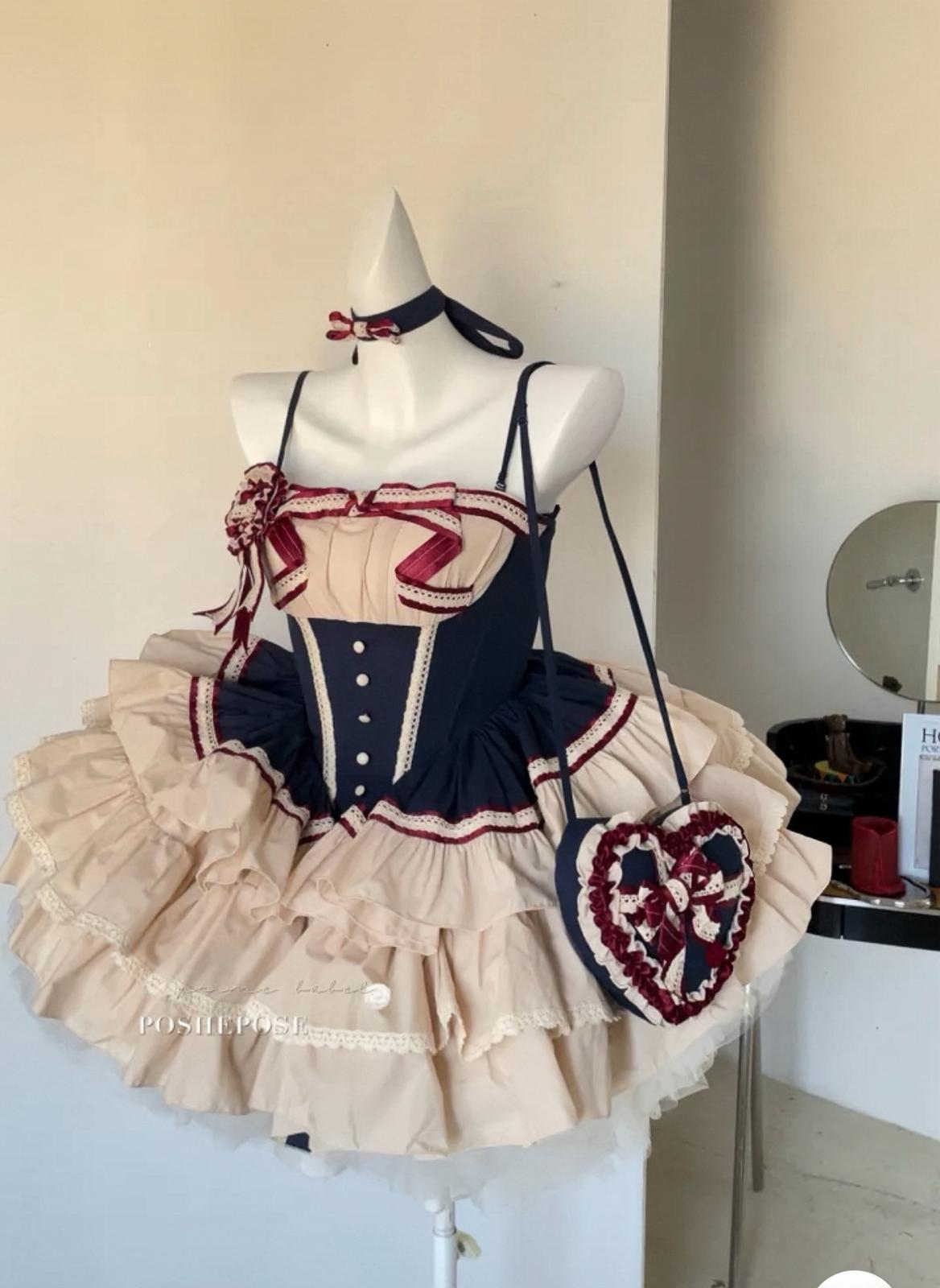 Elegant Snow White-inspired lolita outfit with navy bodice and vintage heart motifs.
