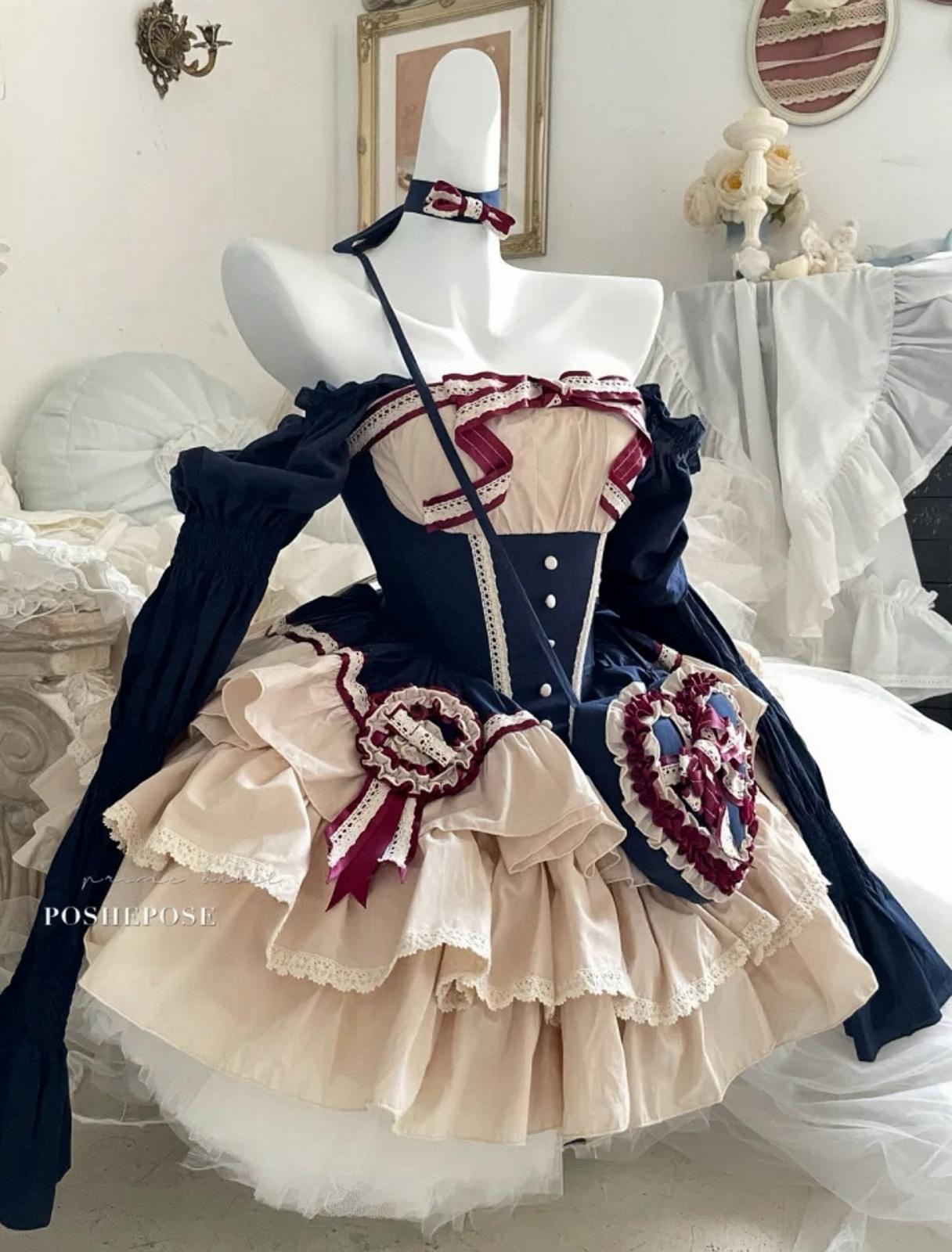 Poshepose Global Snow White-inspired lolita dress in beige and navy with lace trim.