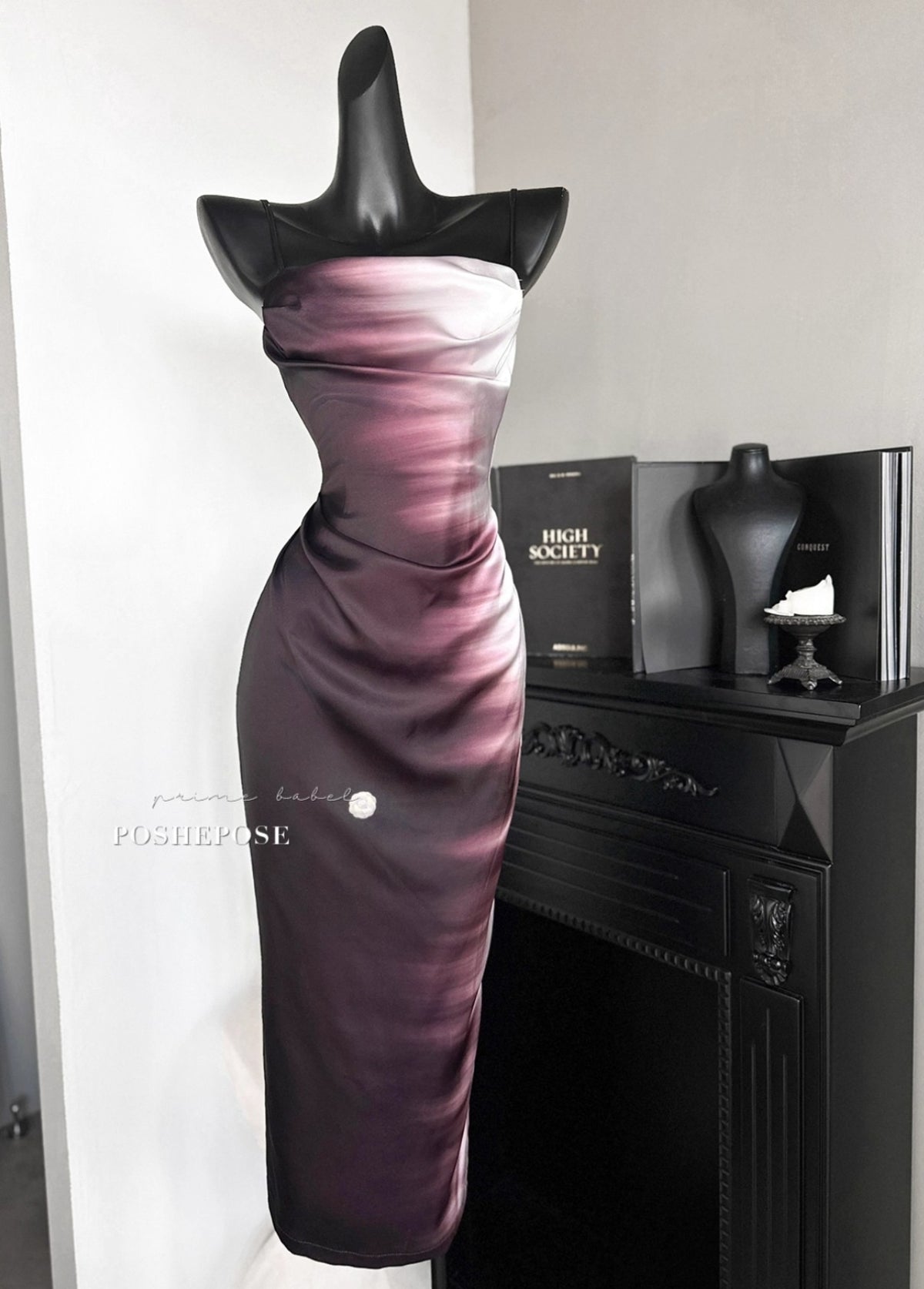 Luxury couture evening dress in rich burgundy tones.