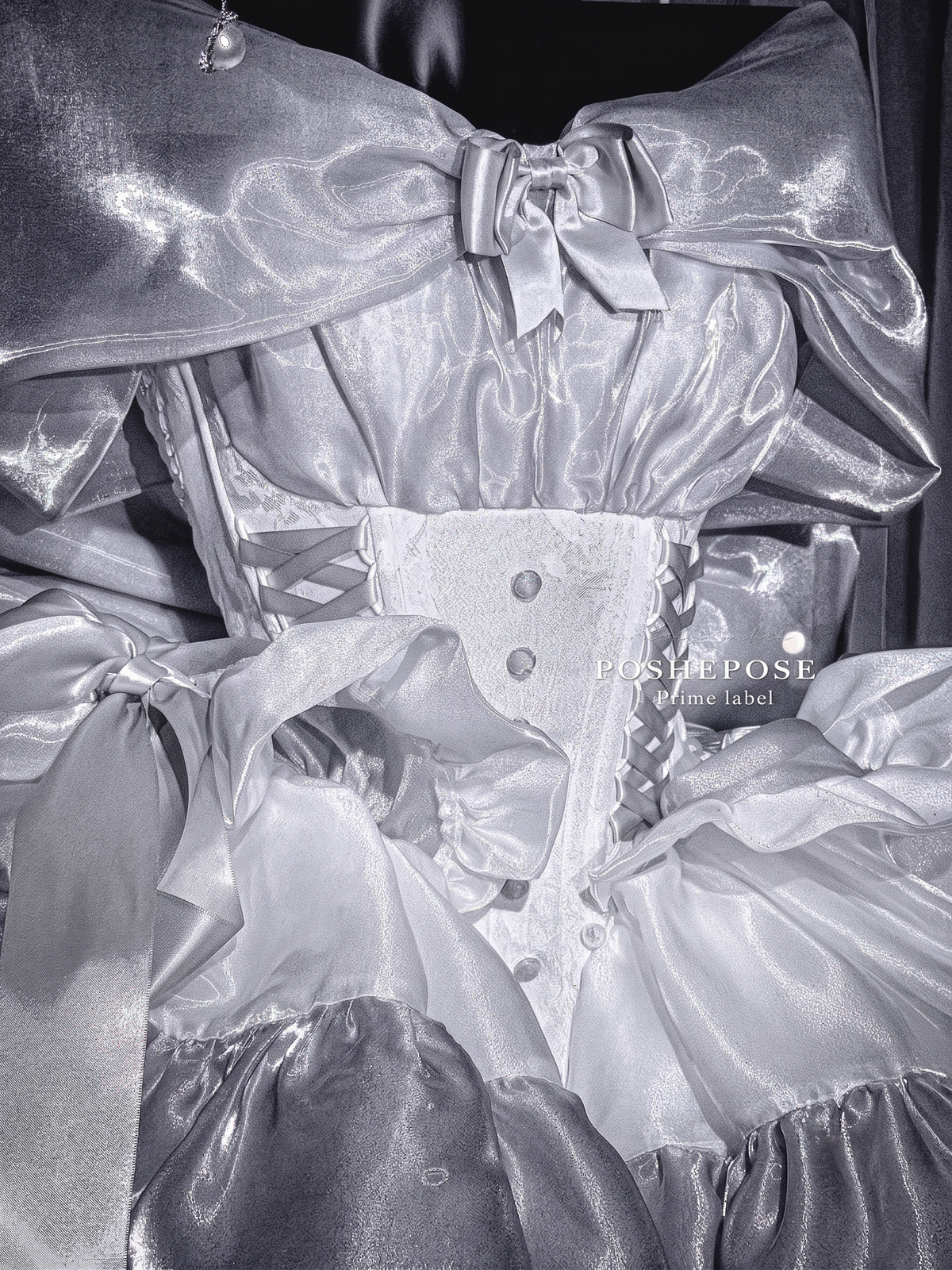 Silver white princess dress with a dramatic oversized bow and layered skirt