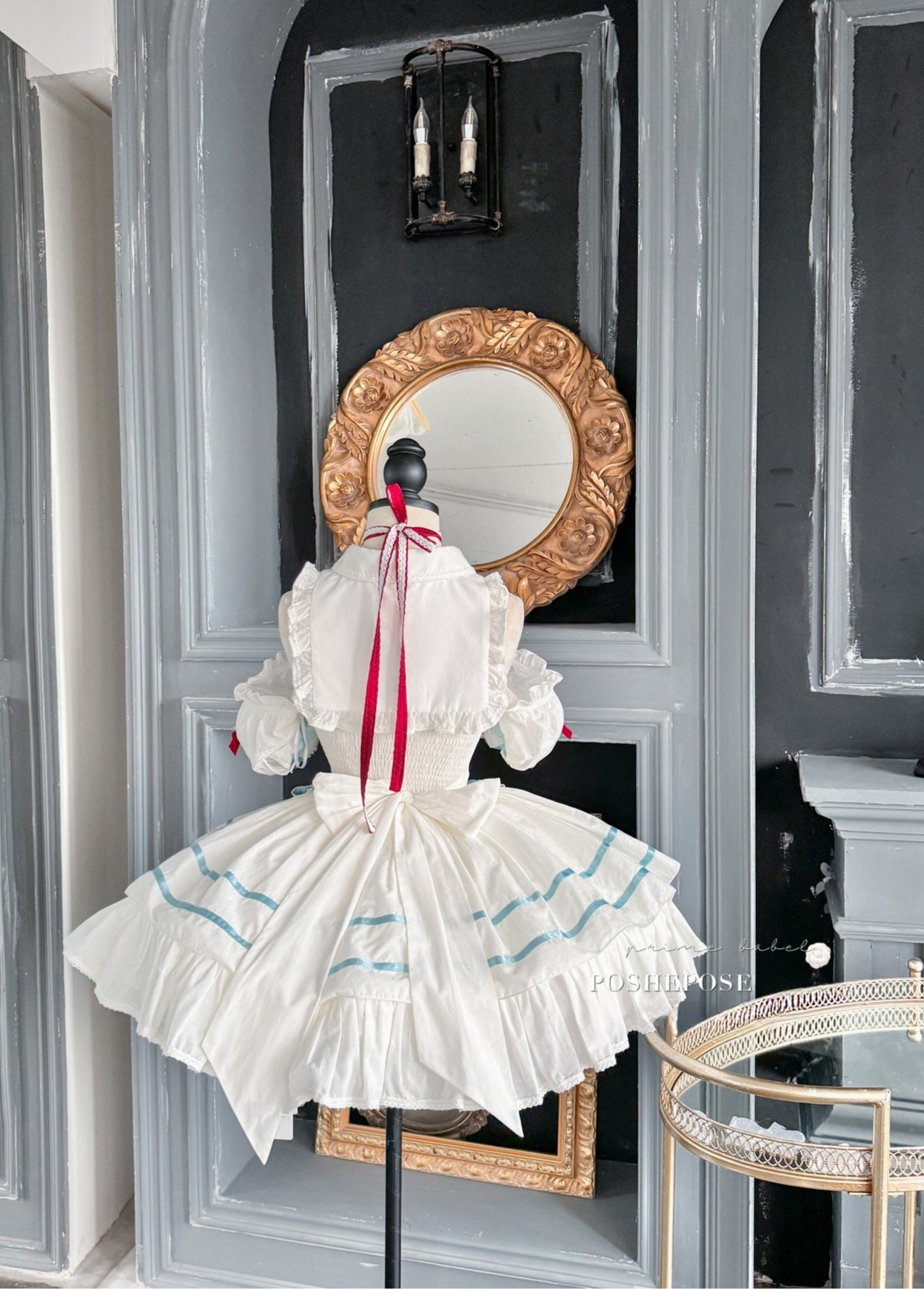 Vintage-inspired Lolita outfit by Poshepose with red and blue bows.